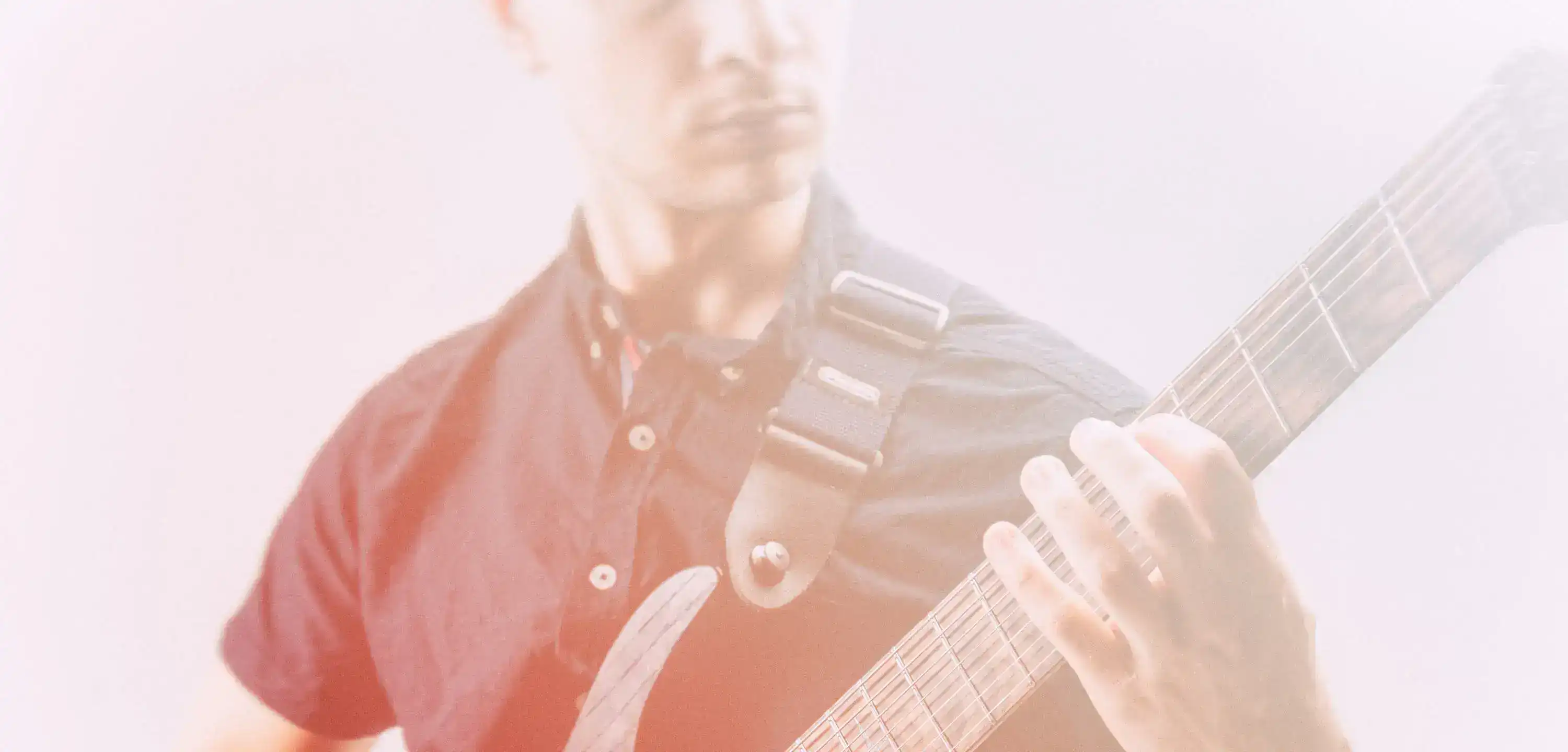 Wojciech Bator with guitar. Close up