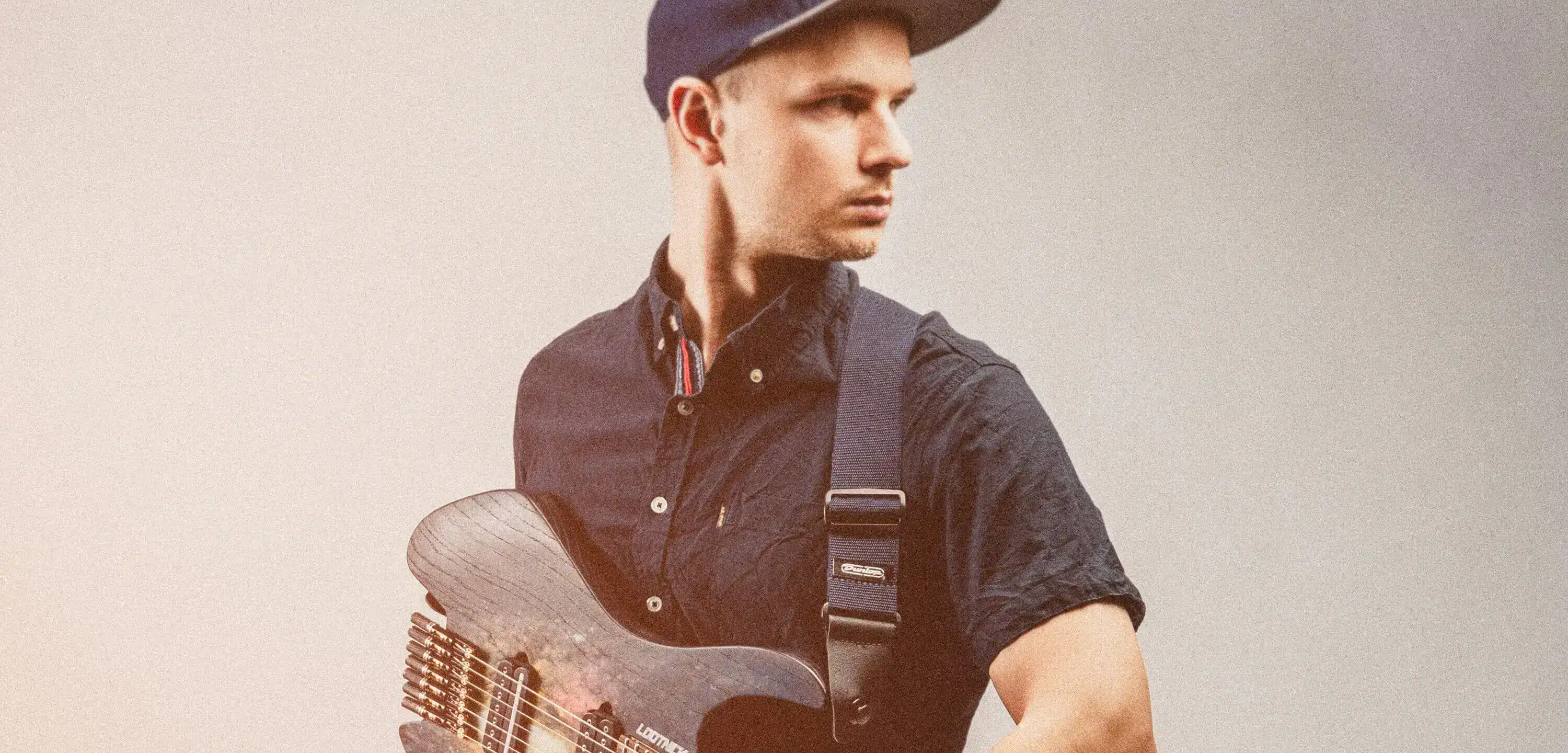 Wojciech Bator standing with guitar